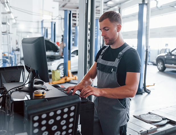 Young man checking out a customer with wifi connected POS system